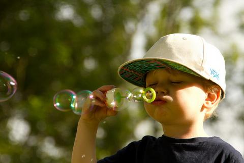 Boy blowing bubbles