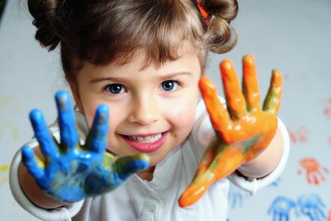 Child with painted hands