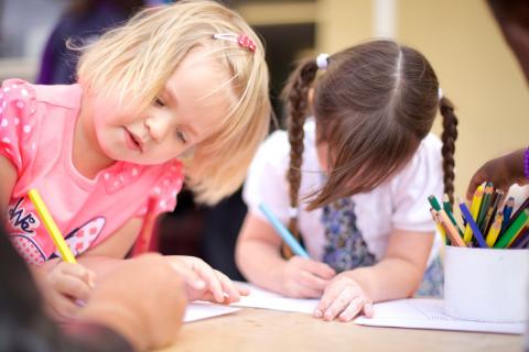 Two girls drawing