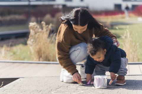 drawing with colorful chalk on the pavement. 