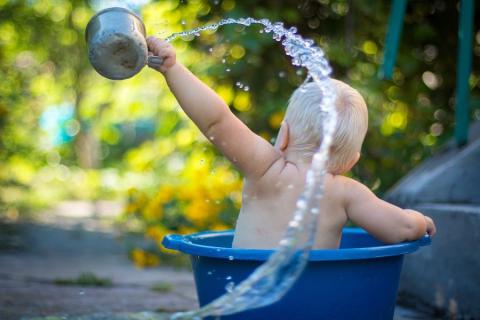 Baby playing with water