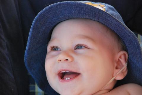 Baby in sunhat smiling