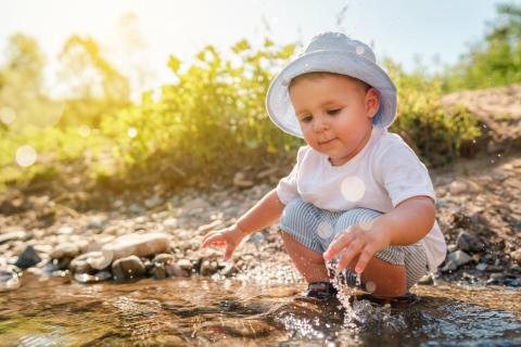 Boy playing in a puddle