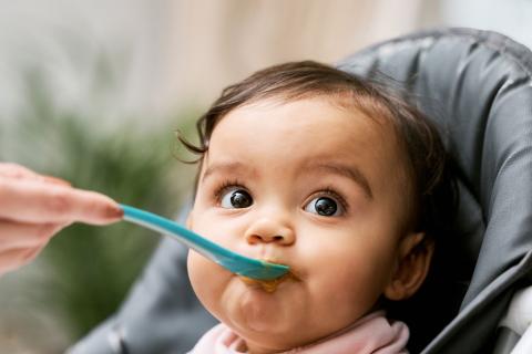 baby being fed with a spoon