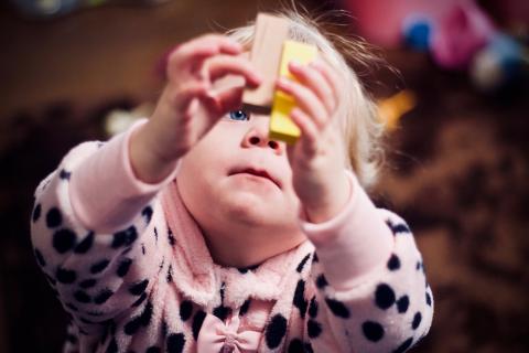 Girl with wooden blocks