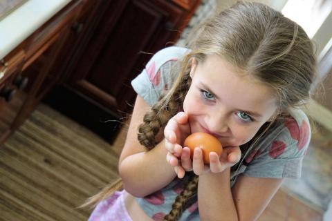 Girl holding egg