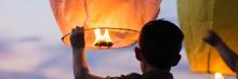 boy holding lantern cropped image