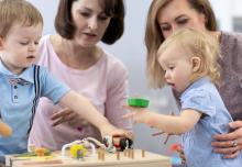 Children and women playing in nursery