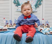 Baby on birthday table