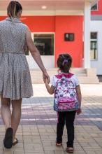 Mother taking child to school