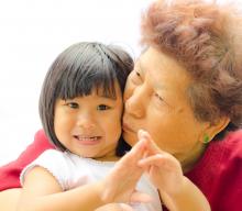 Grandma hugging little girl