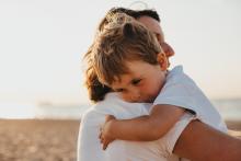 Boy and woman hugging