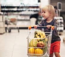 Talking to children about where food comes from - girl shopping in a cart