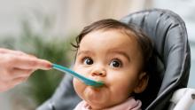 baby being fed with a spoon