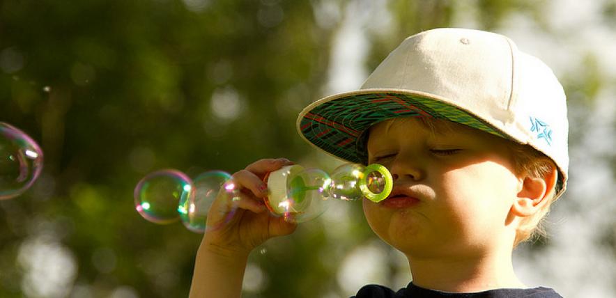 Boy blowing bubbles