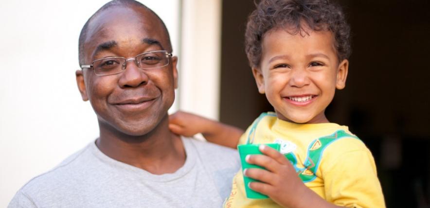 Dad and son smiling