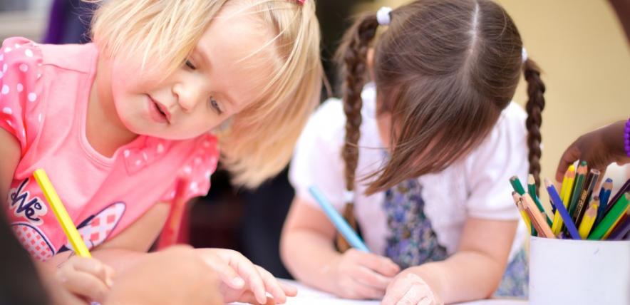 Two girls drawing