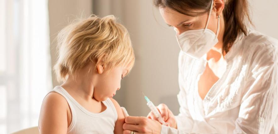 Young boy getting an injection