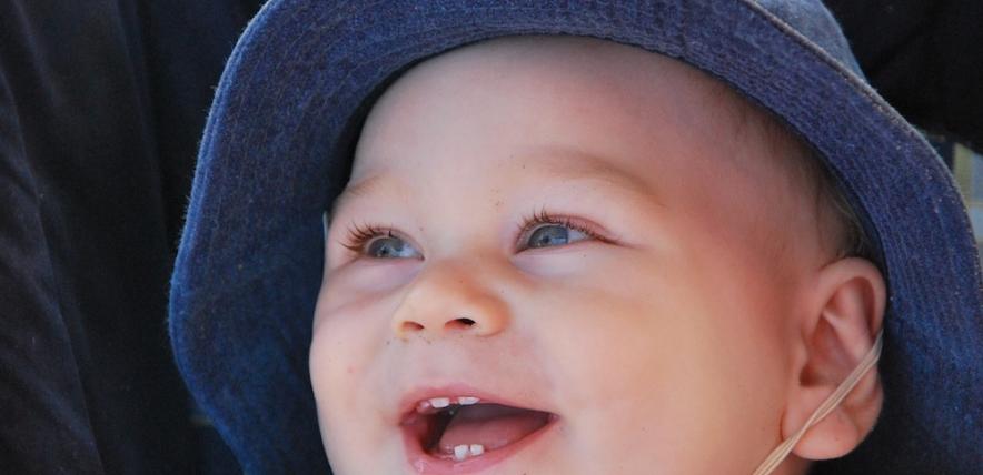 Baby in sunhat smiling