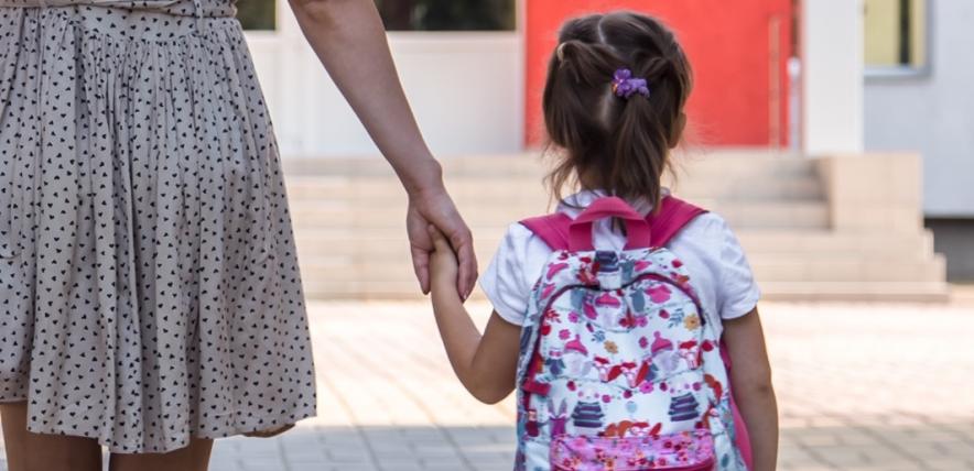 Mother taking child to school