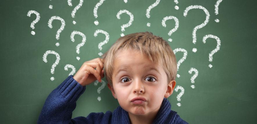 Boy scratching his head because of too many questions