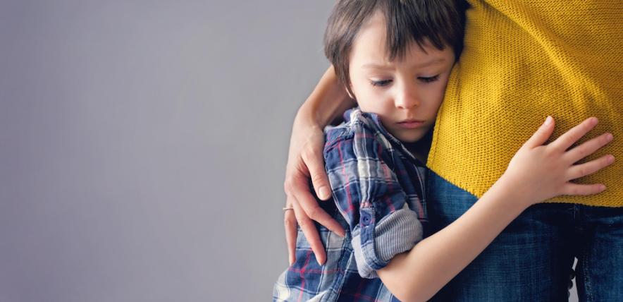 Boy hugging his mum