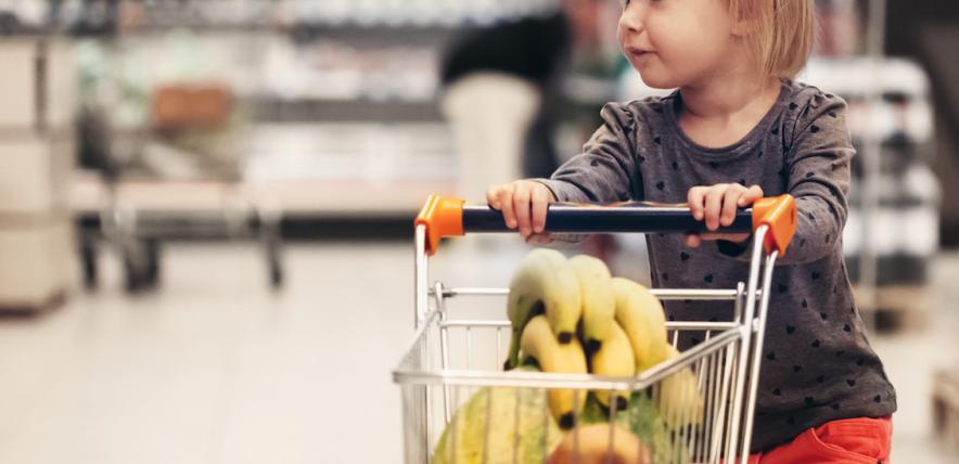 Talking to children about where food comes from - girl shopping in a cart