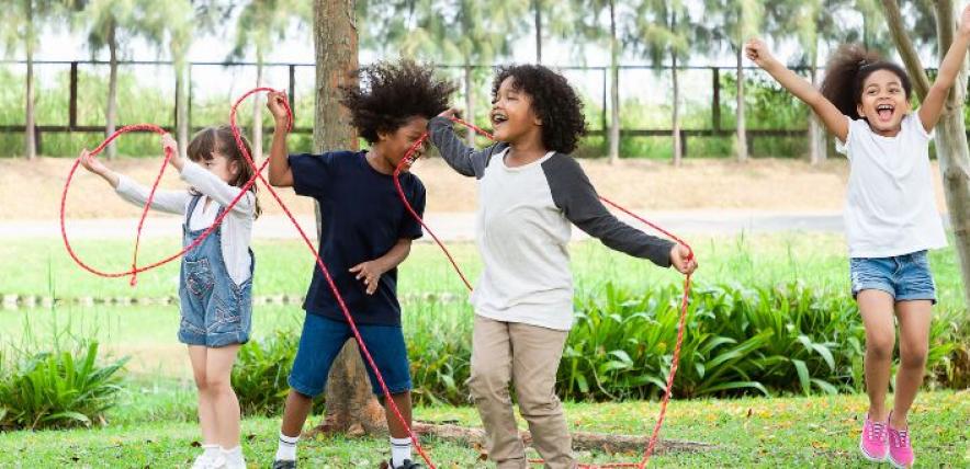Children playing with a skipping rope