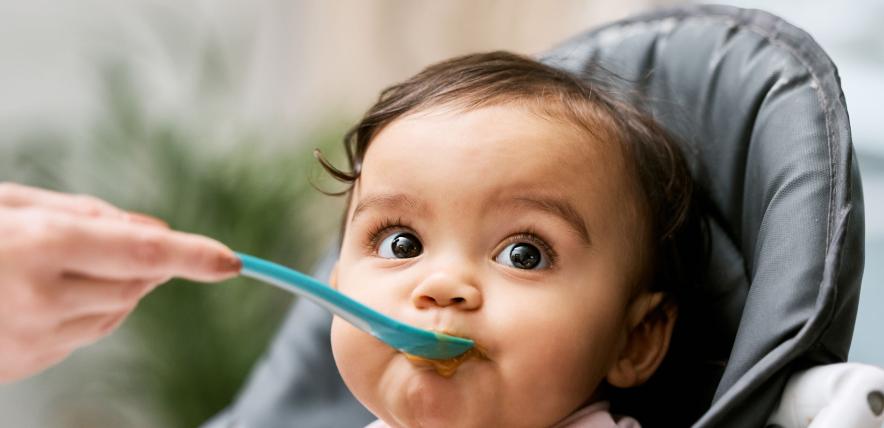 baby being fed with a spoon