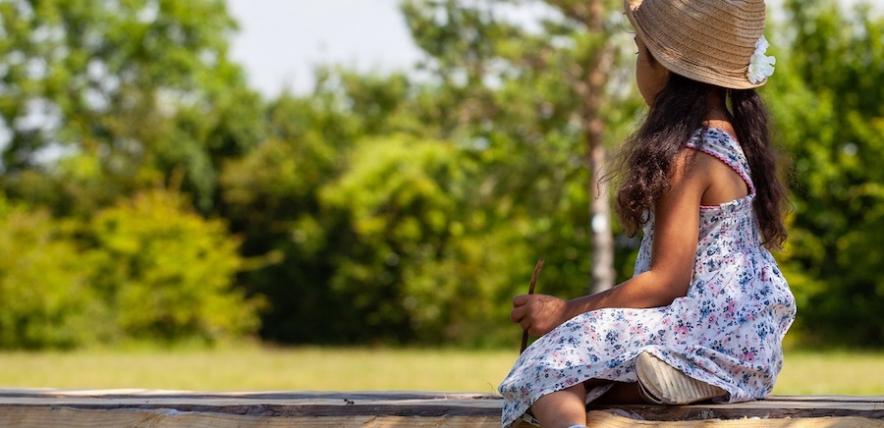 Girl sitting in the shade