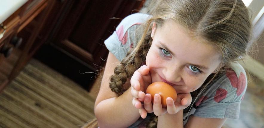 Girl holding egg