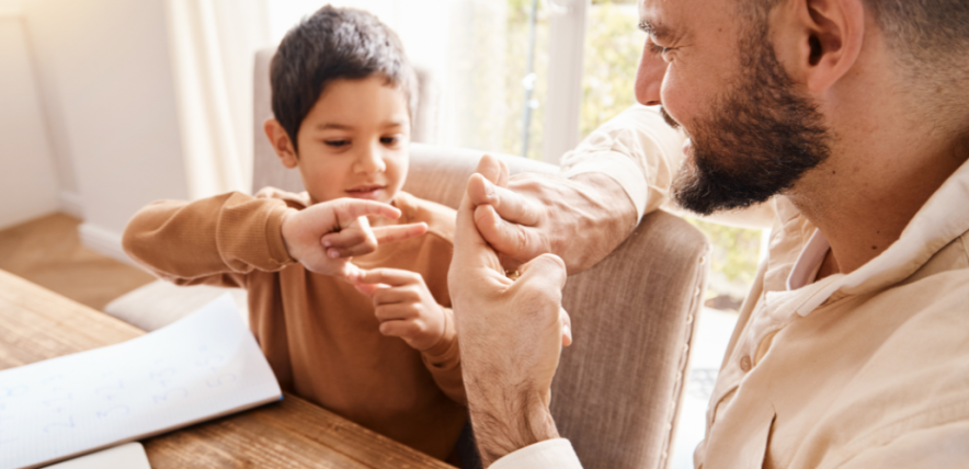 boy and man doing sign language
