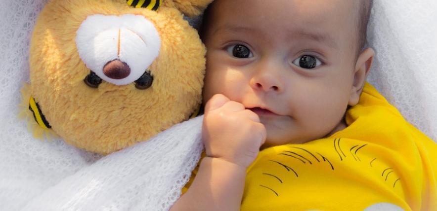 child with teddy bear